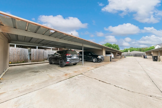 6506 Kentwick Dr, Houston, TX 77084 - covered parking lot featuring fence