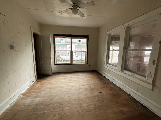 spare room featuring ceiling fan and wood finished floors