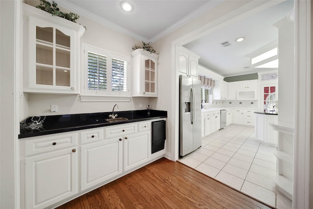 5 Briarwood Dr, Conroe, TX 77301 - kitchen with crown molding, open shelves, white cabinets, appliances with stainless steel finishes, and a sink