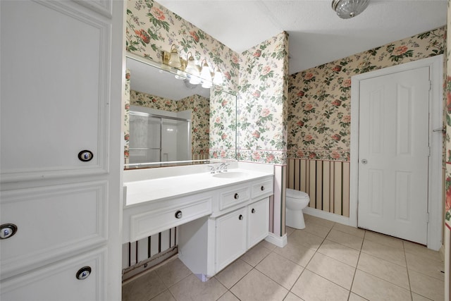 5 Briarwood Dr, Conroe, TX 77301 - bathroom featuring vanity, wallpapered walls, tile patterned floors, toilet, and a shower stall