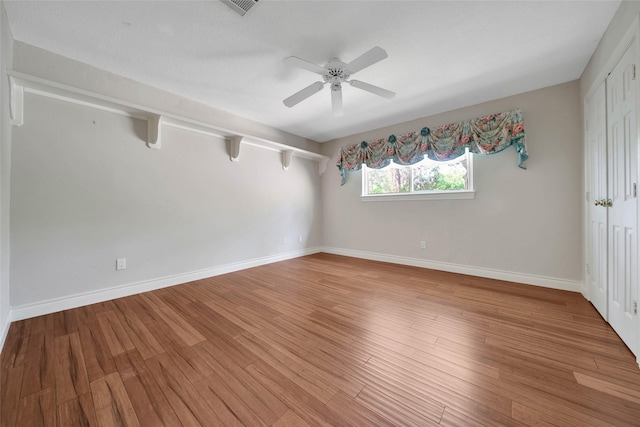 5 Briarwood Dr, Conroe, TX 77301 - unfurnished room with light wood finished floors, baseboards, and a ceiling fan