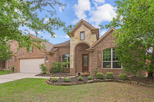 view of front of property featuring roof with shingles, driveway, an attached garage, a front lawn, and brick siding