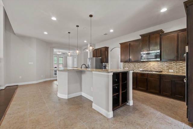 kitchen with backsplash, recessed lighting, and stainless steel appliances
