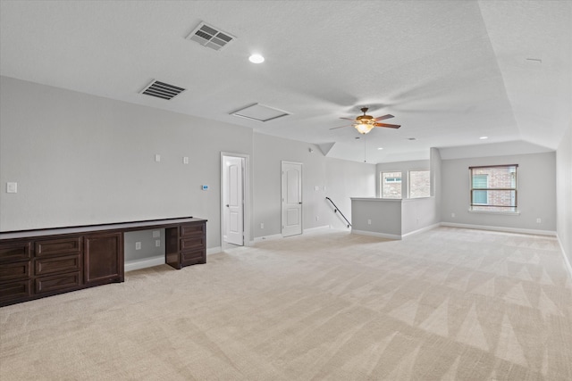 empty room with light colored carpet, baseboards, and visible vents