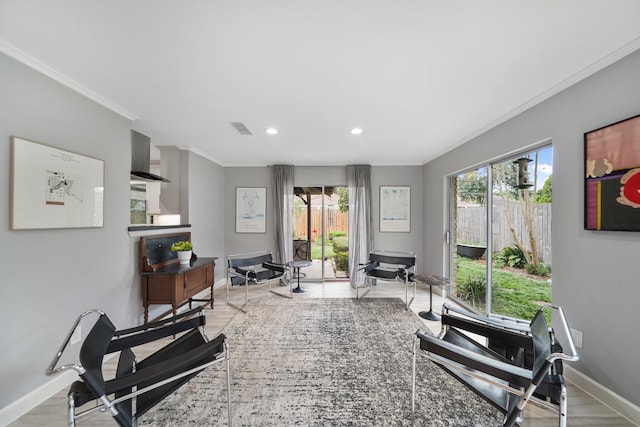 workout room with crown molding, visible vents, baseboards, and plenty of natural light