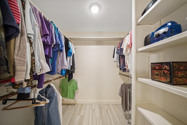 spacious closet featuring wood finished floors