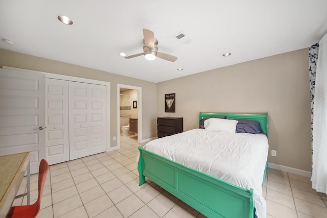 bedroom featuring light tile patterned floors, ceiling fan, a closet, ensuite bath, and recessed lighting