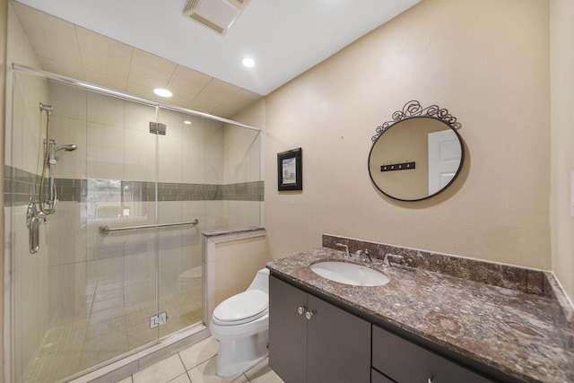 full bath featuring vanity, visible vents, toilet, a stall shower, and tile patterned floors