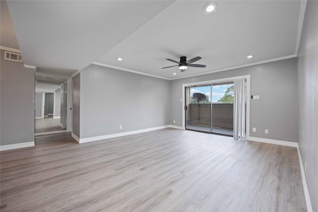 unfurnished room with a ceiling fan, wood finished floors, baseboards, and visible vents