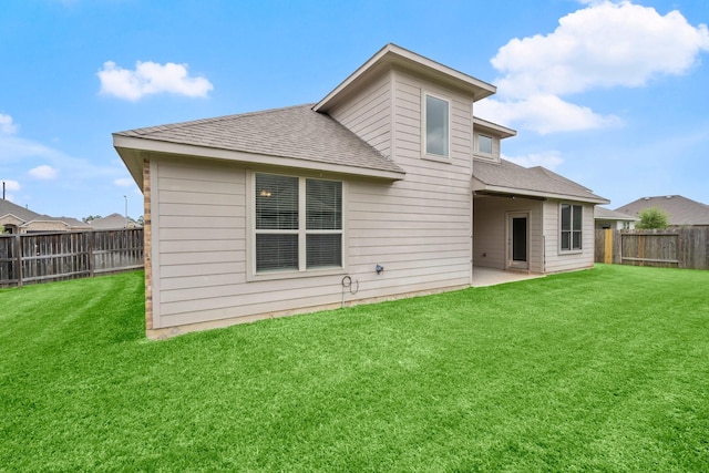 12627 Beddington Ct, Tomball, TX 77375 - rear view of house featuring a shingled roof and a patio area