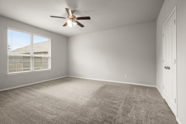 12627 Beddington Ct, Tomball, TX 77375 - empty room featuring ceiling fan, carpet, and baseboards