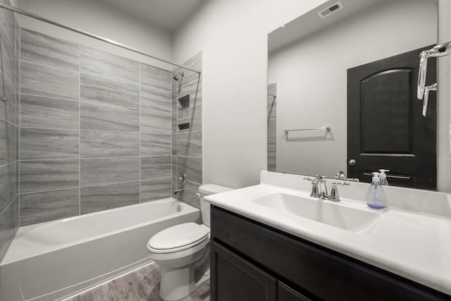 12627 Beddington Ct, Tomball, TX 77375 - full bathroom with toilet, wood finished floors, vanity, and  shower combination