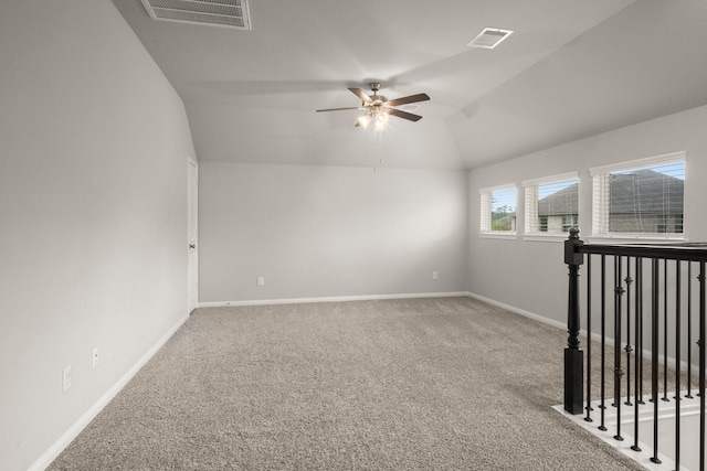 12627 Beddington Ct, Tomball, TX 77375 - carpeted empty room with lofted ceiling, a ceiling fan, and baseboards