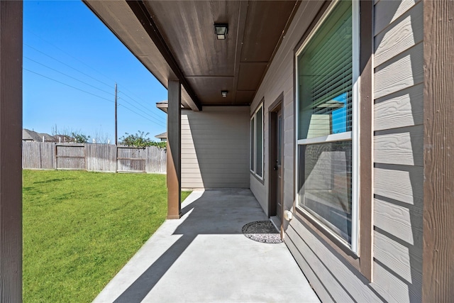 view of patio featuring fence