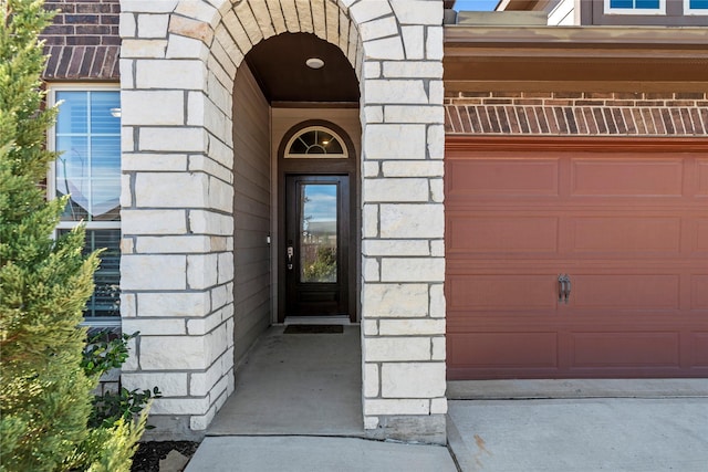property entrance with stone siding