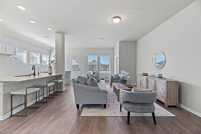 2522 Blazing Star Dr, Brookshire, TX 77423 - living area featuring wood finished floors, baseboards, and recessed lighting