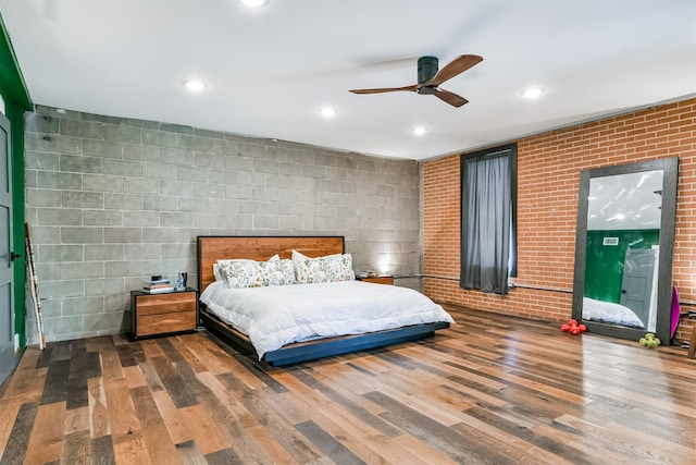2415 Church St, Galveston, TX 77550 - bedroom with a ceiling fan, recessed lighting, brick wall, and wood finished floors