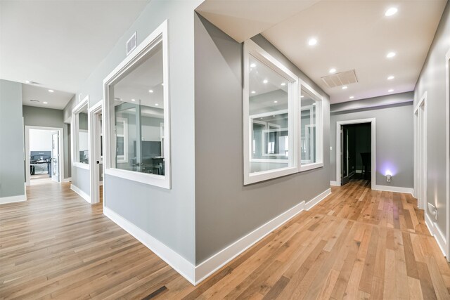 2415 Church St, Galveston, TX 77550 - hall featuring light wood finished floors, baseboards, and visible vents