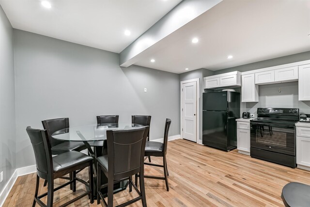2415 Church St, Galveston, TX 77550 - dining area featuring baseboards, light wood-style floors, and recessed lighting