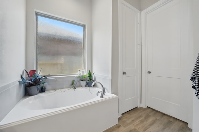 7323 Perching Hawk Trl, Katy, TX 77493 - full bathroom featuring a bath and wood finished floors