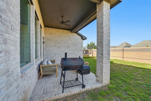 7323 Perching Hawk Trl, Katy, TX 77493 - view of patio with area for grilling, a trampoline, fence, and a ceiling fan
