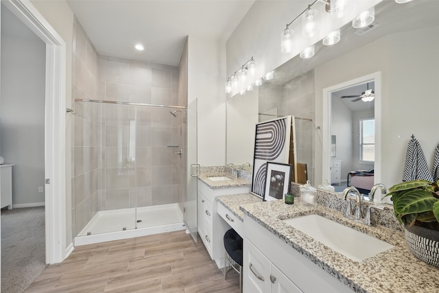 7323 Perching Hawk Trl, Katy, TX 77493 - ensuite bathroom with a shower stall, visible vents, and a sink