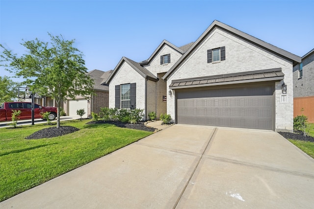 7323 Perching Hawk Trl, Katy, TX 77493 - view of front of home with a garage, brick siding, a front lawn, driveway, and roof with shingles