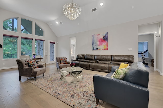 5119 Long Branch Bnd, Fulshear, TX 77441 - living area with a chandelier, healthy amount of natural light, high vaulted ceiling, light wood finished floors, and recessed lighting