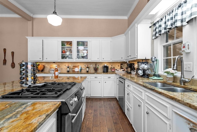 712 Lamar Ave, Crockett, TX 75835 - kitchen with white cabinets, a sink, crown molding, and appliances with stainless steel finishes