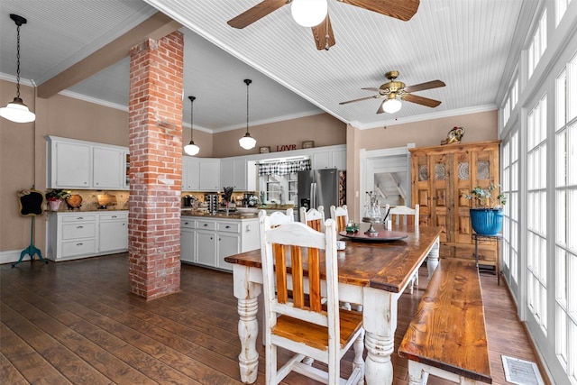 712 Lamar Ave, Crockett, TX 75835 - dining area with decorative columns, a ceiling fan, crown molding, and visible vents