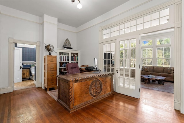 712 Lamar Ave, Crockett, TX 75835 - home office with french doors, plenty of natural light, and wood finished floors