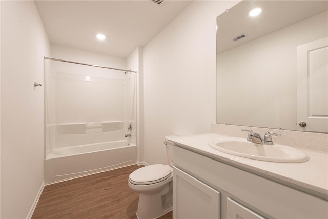 913 Oak Mist Ln, Magnolia, TX 77354 - full bathroom with visible vents, wood finished floors, baseboards, vanity, and toilet