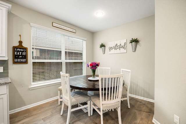 16875 Olympic National Dr, Humble, TX 77346 - dining room with baseboards and light wood-style floors