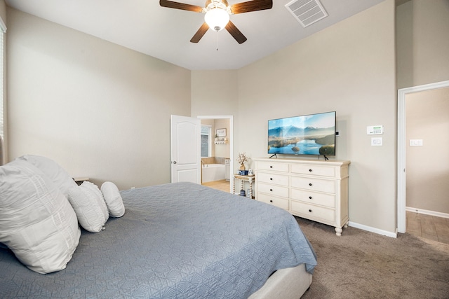 16875 Olympic National Dr, Humble, TX 77346 - carpeted bedroom with baseboards, a ceiling fan, and ensuite bathroom