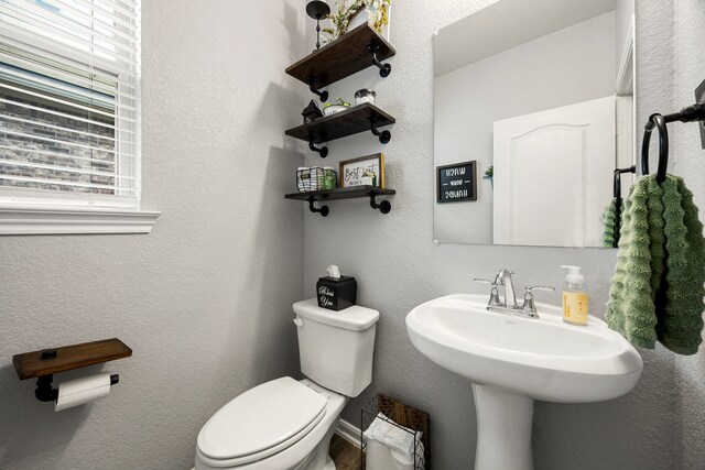 16875 Olympic National Dr, Humble, TX 77346 - half bath featuring toilet and a textured wall