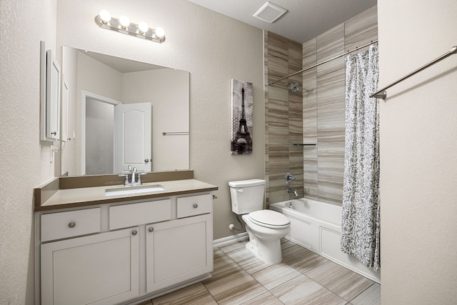 16875 Olympic National Dr, Humble, TX 77346 - bathroom featuring toilet, vanity, shower / bath combination with curtain, and a textured wall