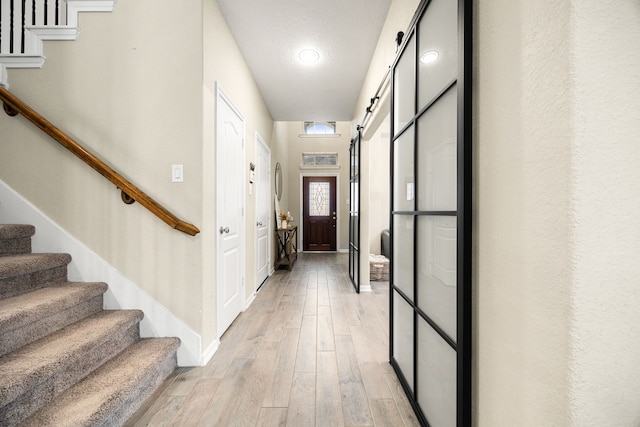 16875 Olympic National Dr, Humble, TX 77346 - foyer with stairway, light wood finished floors, and baseboards