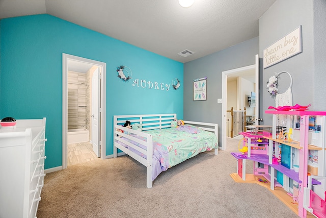 16875 Olympic National Dr, Humble, TX 77346 - bedroom with carpet floors, connected bathroom, vaulted ceiling, and baseboards