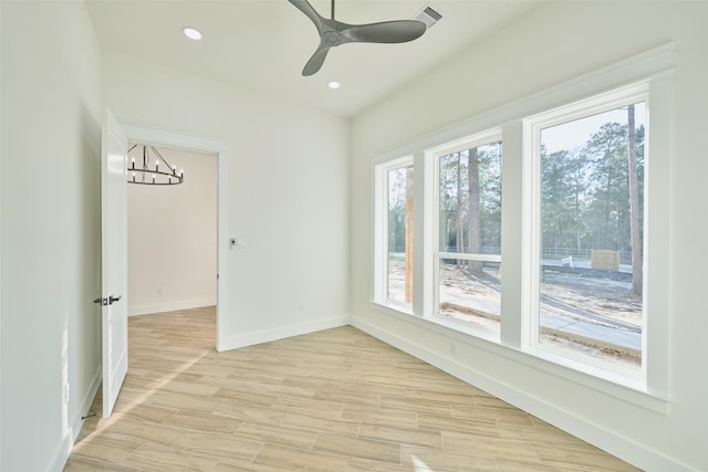 118 Ranger Rd, Huntsville, TX 77340 - unfurnished room featuring baseboards, a chandelier, recessed lighting, light wood-type flooring, and a ceiling fan