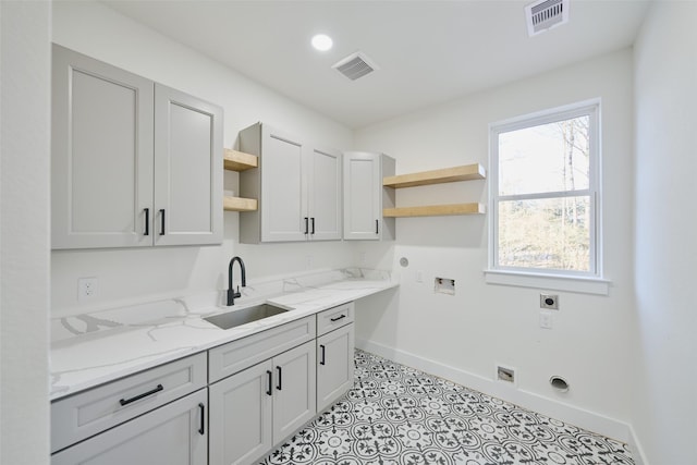118 Ranger Rd, Huntsville, TX 77340 - laundry room with hookup for an electric dryer, cabinet space, washer hookup, and gas dryer hookup