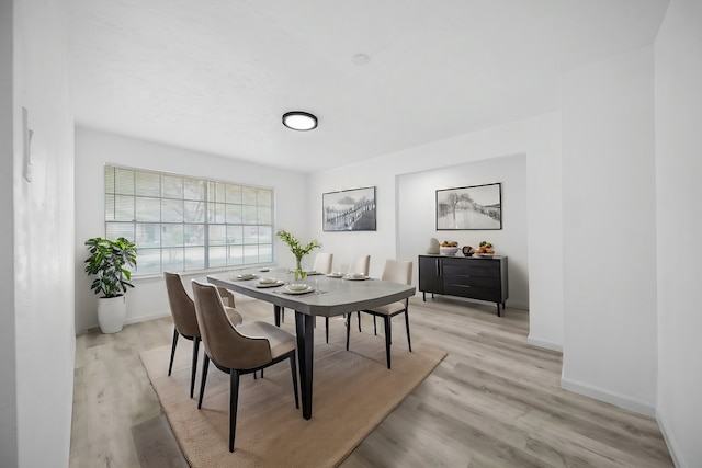 19207 Woodglen Dr, Katy, TX 77449 - dining space featuring baseboards and light wood-style floors