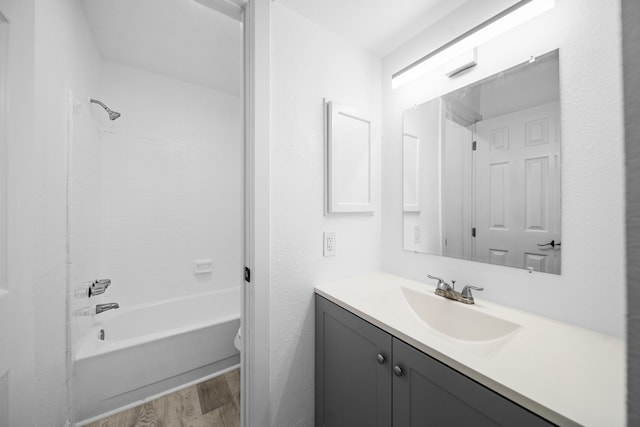 19207 Woodglen Dr, Katy, TX 77449 - bathroom with bathtub / shower combination, toilet, wood finished floors, and vanity