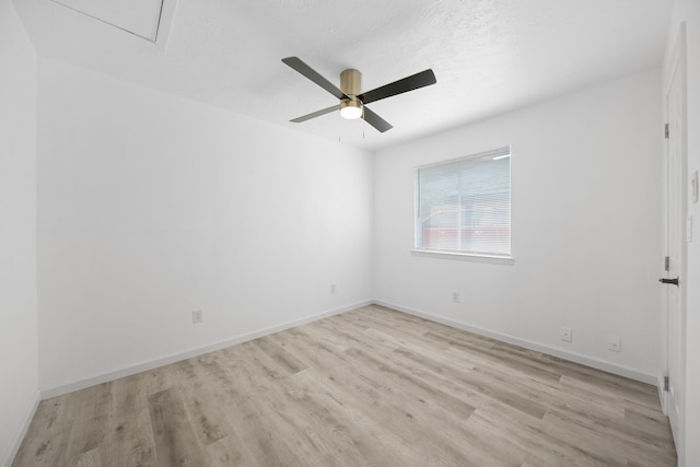 19207 Woodglen Dr, Katy, TX 77449 - unfurnished room with a textured ceiling, baseboards, ceiling fan, and wood finished floors