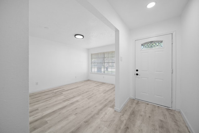 19207 Woodglen Dr, Katy, TX 77449 - entryway with light wood-style flooring and baseboards