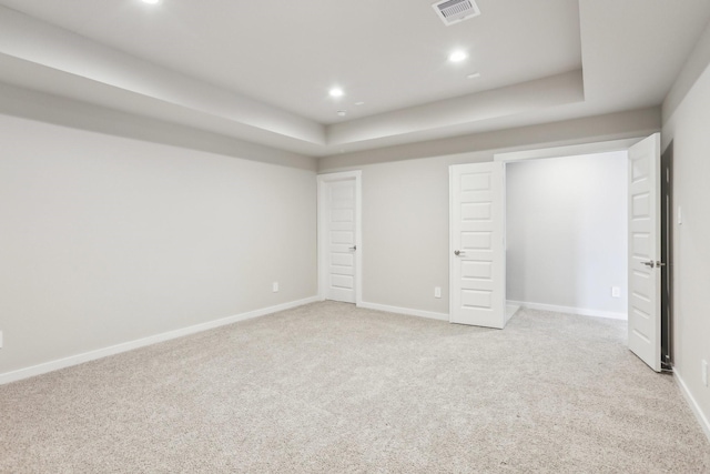 unfurnished bedroom featuring light colored carpet, recessed lighting, and baseboards