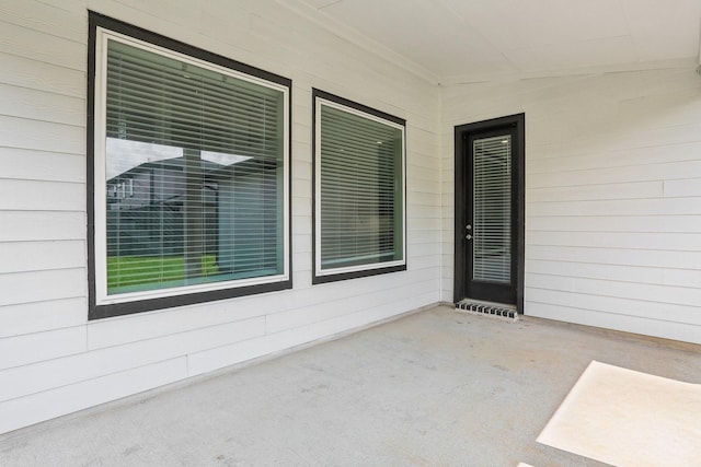 property entrance featuring a patio area