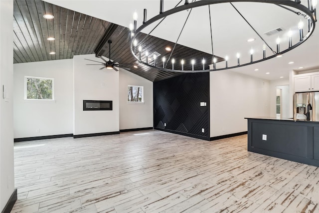 24717 Sligo St, Hempstead, TX 77445 - interior space with visible vents, light wood finished floors, baseboards, ceiling fan, and lofted ceiling