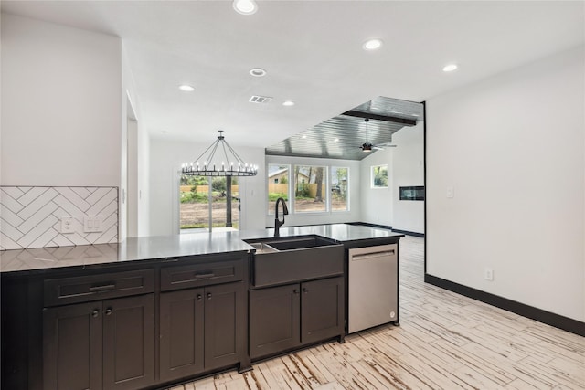 24717 Sligo St, Hempstead, TX 77445 - kitchen with decorative backsplash, a sink, dark countertops, dishwasher, and a peninsula