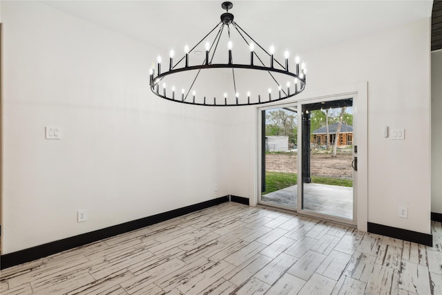 24717 Sligo St, Hempstead, TX 77445 - unfurnished dining area with baseboards and an inviting chandelier