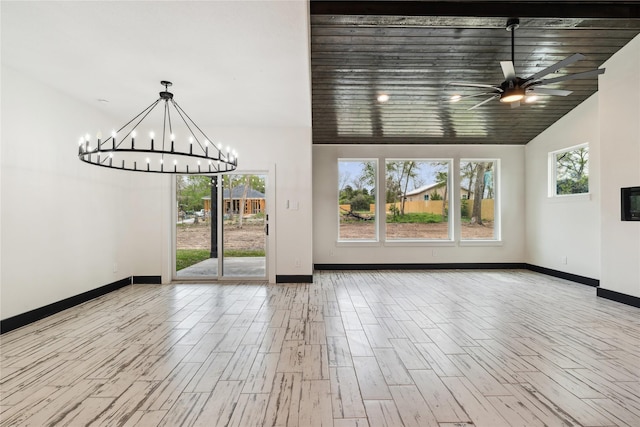 24717 Sligo St, Hempstead, TX 77445 - interior space with ceiling fan with notable chandelier, baseboards, vaulted ceiling, and wood finished floors
